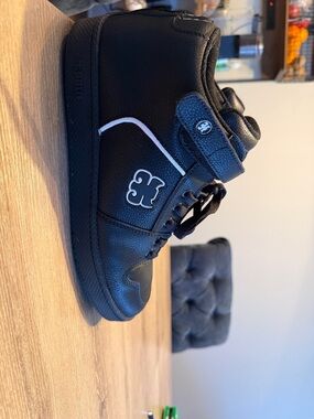 Black High-Top Sneakers with White Accent by Unknown